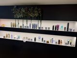 many different types of skin care products displayed on the wall