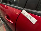 a sticker on the door of a red car