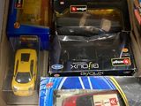 many toy cars and remotes in a box