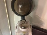 a coffee grinder sitting on a counter in a coffee shop