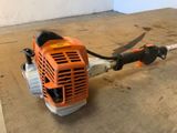 a close up of a small blower sitting on top of a wooden floor