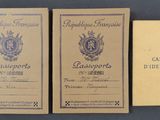 three old french passport cards sitting next to each other on a table