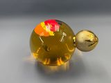 yellow glass perfume bottle with a red and yellow flower on it
