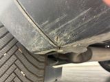 a close up of a car ' s tire on the street