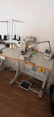 a sewing machine sitting on a table in a room