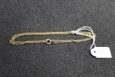 a close up of a gold chain with a tag on it