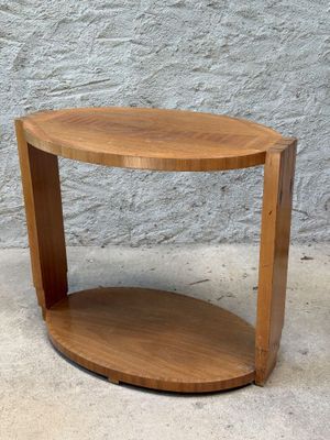 a close up of a wooden table with a shelf on it
