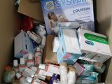 a cardboard box full of baby products and other items