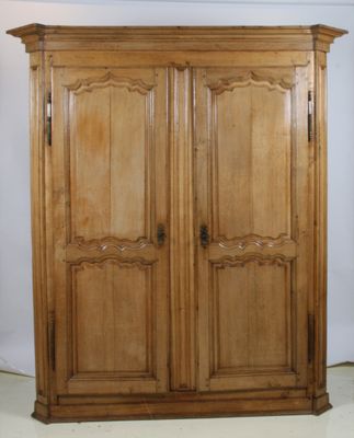 a wooden armoire with two doors on each side