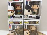 funko pop vinyl figures in a basket on top of a table
