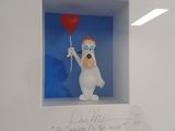 a picture of a polar bear holding a red balloon