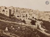 a black and white photo of an old city in the middle of the day