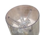 a glass container with ice in it on a white surface