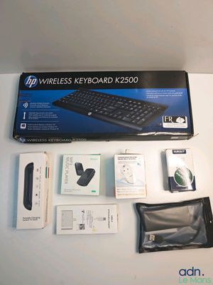 a box with a keyboard, mouse, and other items on it
