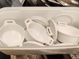 a lot of dishes in a white bowl on a table
