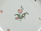 a white plate with a floral design on it