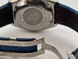 an image of a close up of a watch on a white surface
