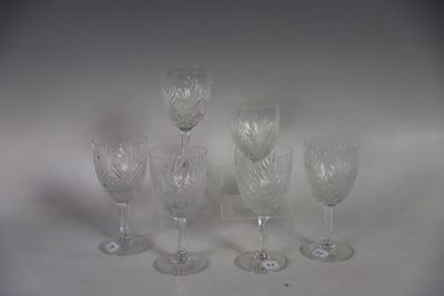 five wine glasses sitting on a table with a white background