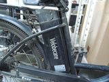 a bicycle that is parked next to a building