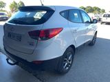a picture of a white car parked in a parking lot