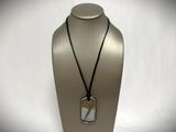a close up of a necklace on a mannequin mannequin