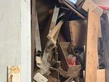 a pile of junk in a room with a window