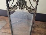 a large metal lantern on the floor in the room