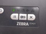 a close up of a zebra printer with buttons on it