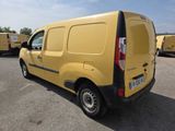 the back of a yellow van parked in a parking lot