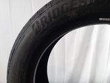 a close up of a tire on a white surface with a white background