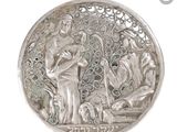 an image of a silver coin with a picture of a man and a woman