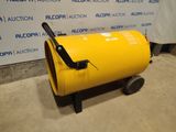 an image of a yellow barrel sitting on top of a cement floor