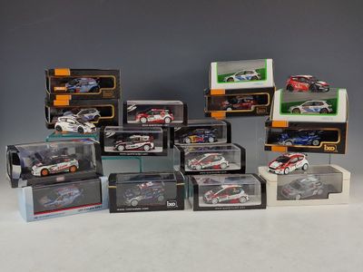 many different models of cars in boxes on the table