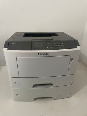 a gray and white printer sitting on top of a counter