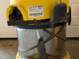 an image of a yellow vacuum cleaner sitting on top of a floor