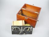 a small wooden box with a wooden handle and a wooden box with a wooden handle