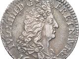 a close up of a coin with a woman ' s head on it