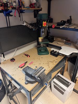 a workbench with tools on it in a garage