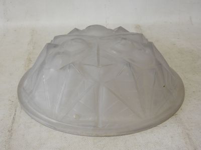 a plastic cake pan sitting on a white surface