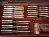 a case with silverware in it on a table