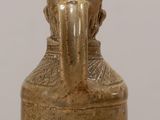 a small vase that is sitting on a table