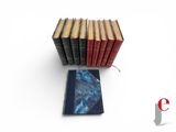 several books are stacked on top of each other on a white surface