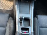 a car dashboard with a steering wheel and a control panel