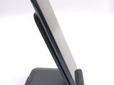 a cell phone that is sitting on top of a stand
