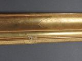 an image of a gold frame with a bird on it