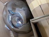 a box with a helmet on top of it next to a cardboard box