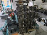 a very tall tower of wine bottles in a store