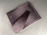 a box that has a tie in it on a table