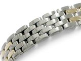 an image of a close up of a watch bracelet on a white surface