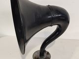an antique black horn horn on a metal stand